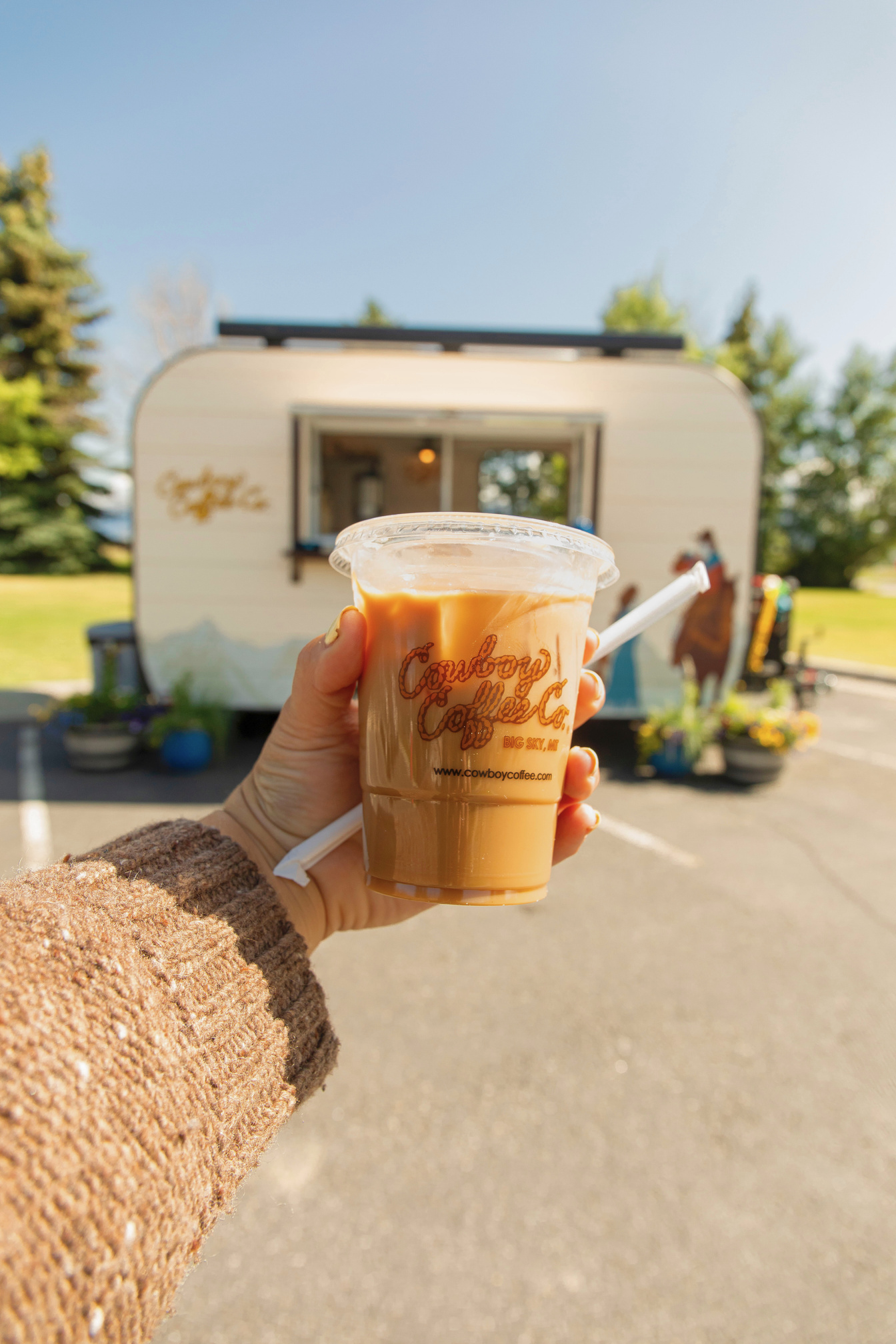 Iced Cowboy Coffee Co. brew with the trailer in the background
